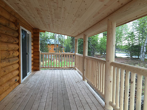 Relax on the porch or by the fire pit at Kasilof Cabins