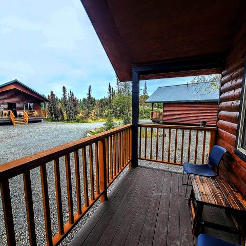 a wooden bench on the side of a building