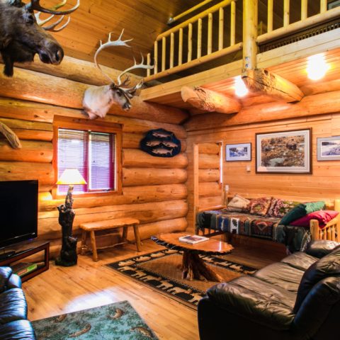 a living room filled with furniture and a fireplace