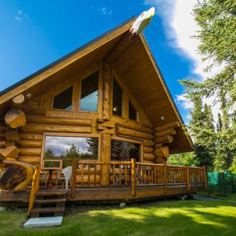 a wooden bench in front of a house