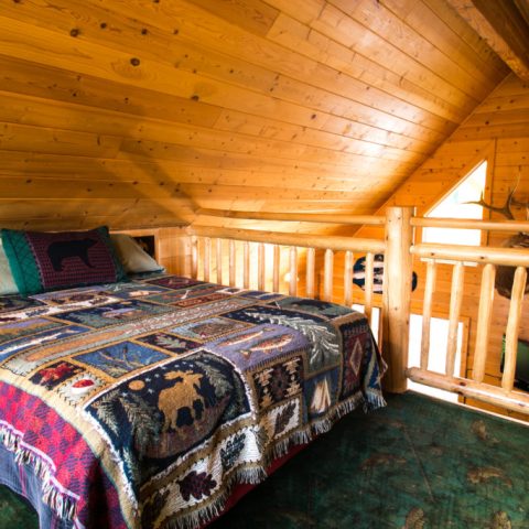 a bedroom with a bed in a room