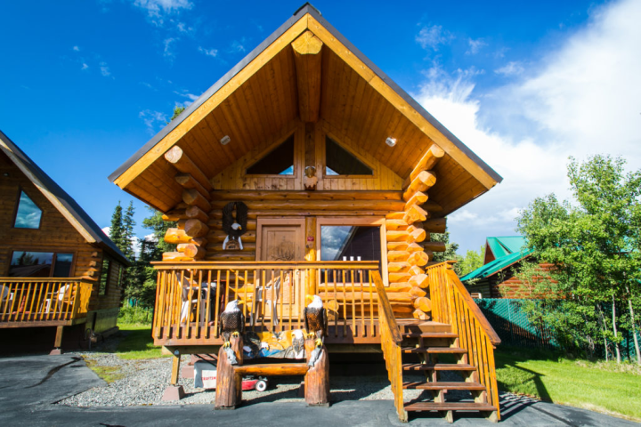 a wooden bench in front of a building