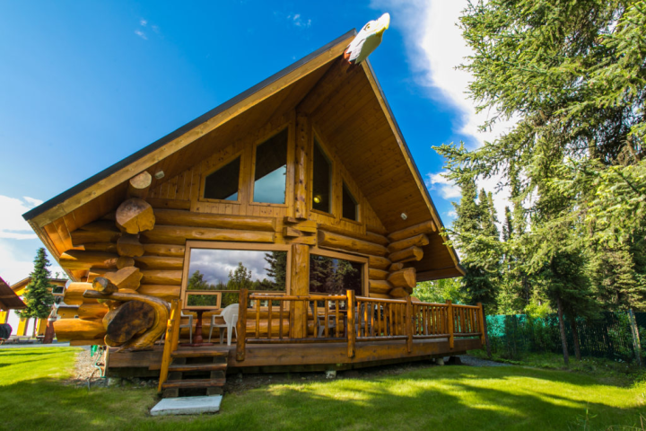 a wooden bench in front of a house