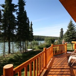 a wooden bench on the side of a building