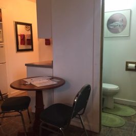 a desk with a chair in a room