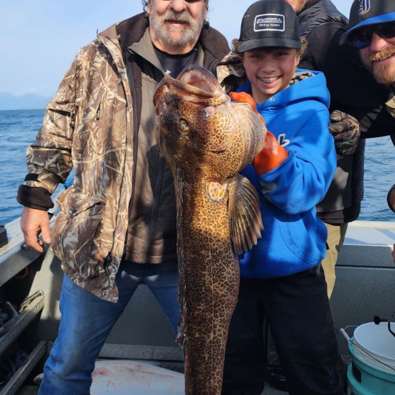 a person holding a fish