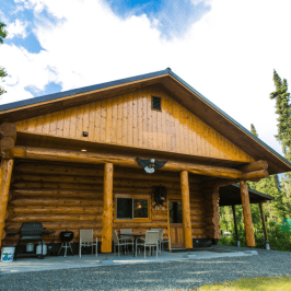 a house that has a clock on the side of a building
