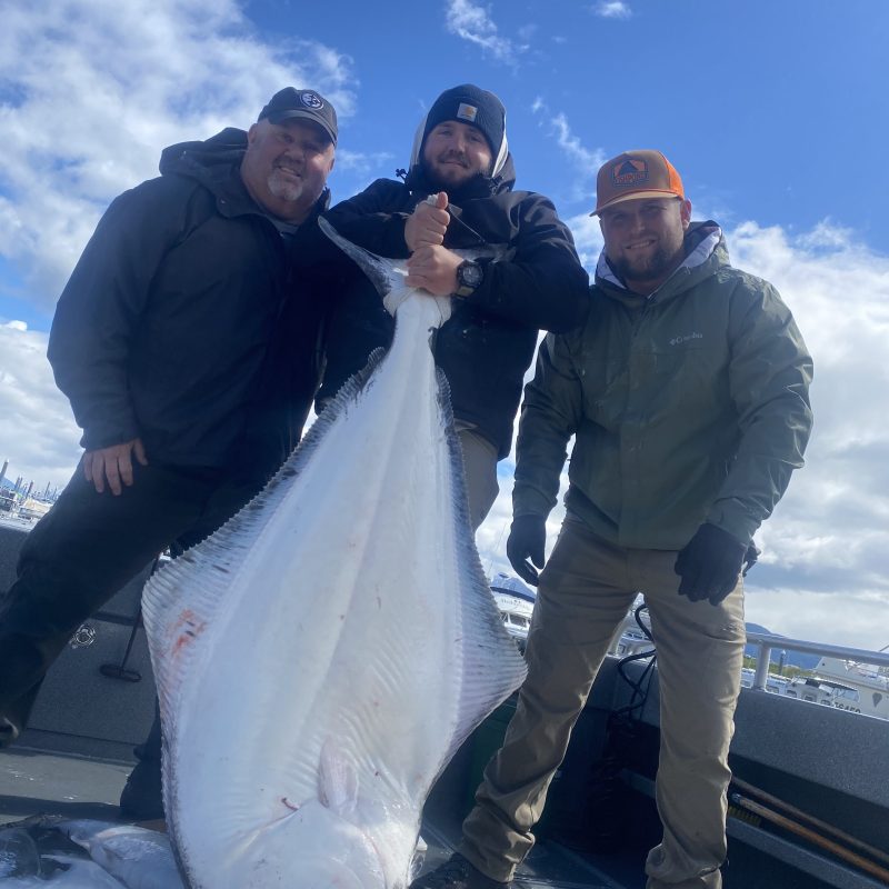 a man holding a fish